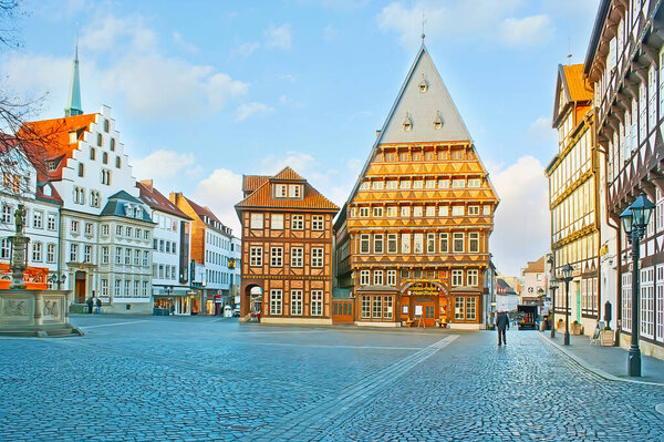 HILDESHEIM, GERMANY - NOVEMBER 22, 2012: The  Markt is famous for its ornate historic half-timber houses - Bakers and Butchers Guild Houses, stepped gable Roland House, on Nov 22 in Hildesheim