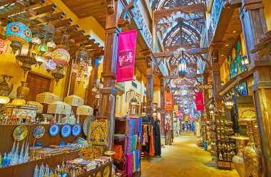 DUBAI, UAE - MARCH 4, 2020: The alleyway of Souk Madinat Jumeirah market is lined with stalls, offering traditional goods - Arabian lights, oil lamps, brass tableware, scarves, on March 4 in Dubai