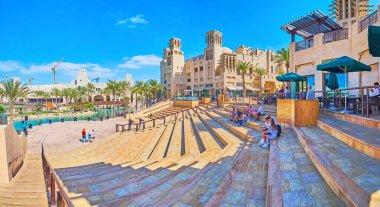 DUBAI, UAE - MARCH 4, 2020: Panorama of the amphitheater and the stage of Souk Madinat Jumeirah market complex with canal in background, on March 4 in Dubai