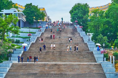 ODESSA, UKRAINE - June 18, 2021: The monumental historic Potemkin Stairs and the bronze monument to Duc de Richelieu on the top, on June 18 in Odessa clipart