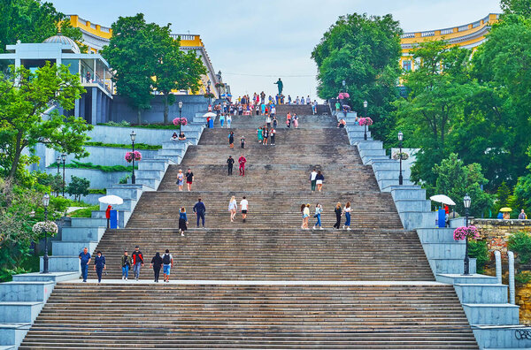 ODESSA, UKRAINE - June 18, 2021: The monumental historic Potemkin Stairs and the bronze monument to Duc de Richelieu on the top, on June 18 in Odessa