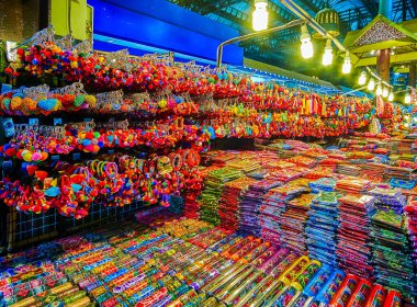 The stall of Night Market with hanging keychains and other souvenirs, Chiang Mai, Thailand