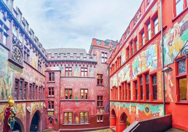 Medieval courtyard of Basel Town Hall with colorful frescoes, Switzerland