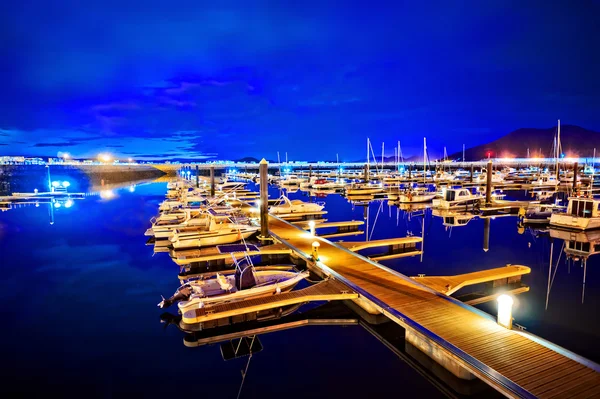 Marina at night with moored yachts — Stock Photo, Image
