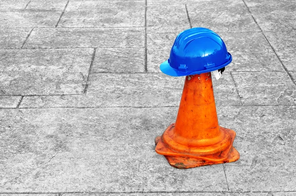 Helmet on plastic cone — Stock Photo, Image