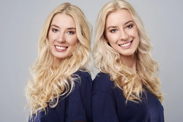 Portrait of twins on light background — Stock Photo, Image