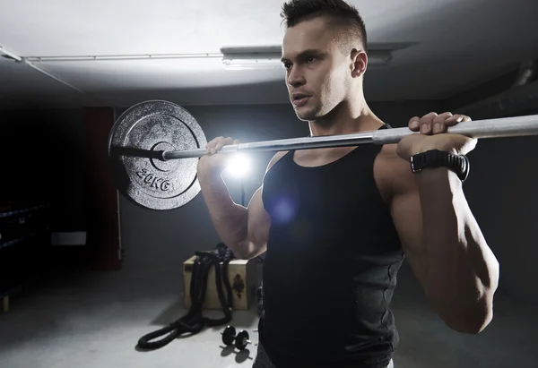Man exercising with barbell — Stock Photo, Image