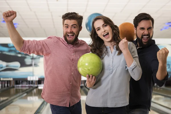 Two men and a woman after good game — Stock Photo, Image