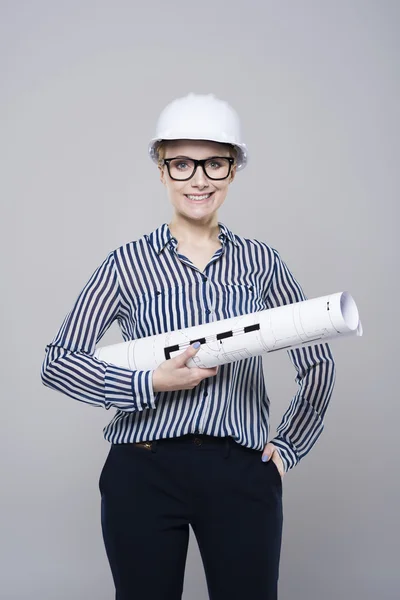 Female engineer with blueprint — Stock Photo, Image