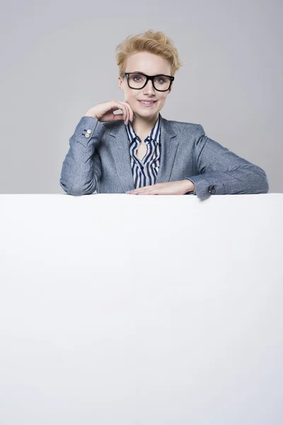 Young office worker and placard — Stock Photo, Image