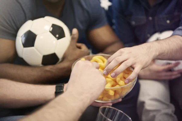 People eating snack during football — Stock Photo, Image