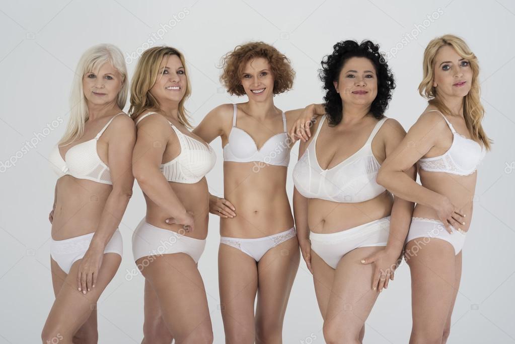 Group of women in classic lingerie Stock Photo by ©gpointstudio