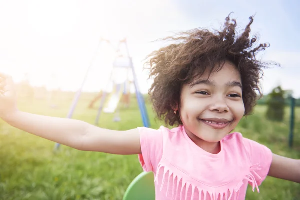 Little african girl playing at the park. — Stock Photo, Image