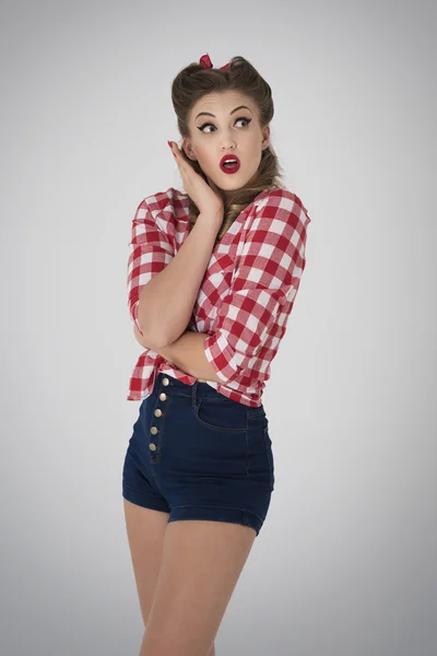 Shocked pin up girl looking up — Stock Photo, Image