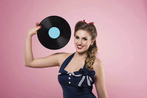 Pin up girl holding vinyl record — Stock Photo, Image