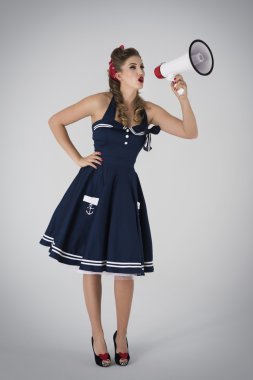 Pin up girl shouting through the loudspeaker clipart