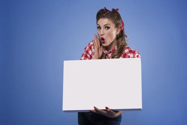 Pin up girl holding white placard — Stock Photo, Image