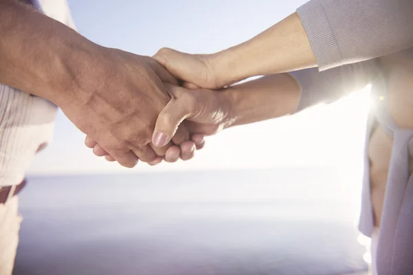 Senior couple holding hands together — Stock Photo, Image