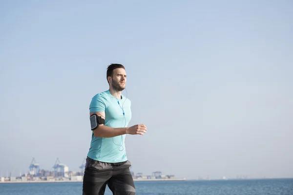 Man jogging in sunny weather — Stock Photo, Image