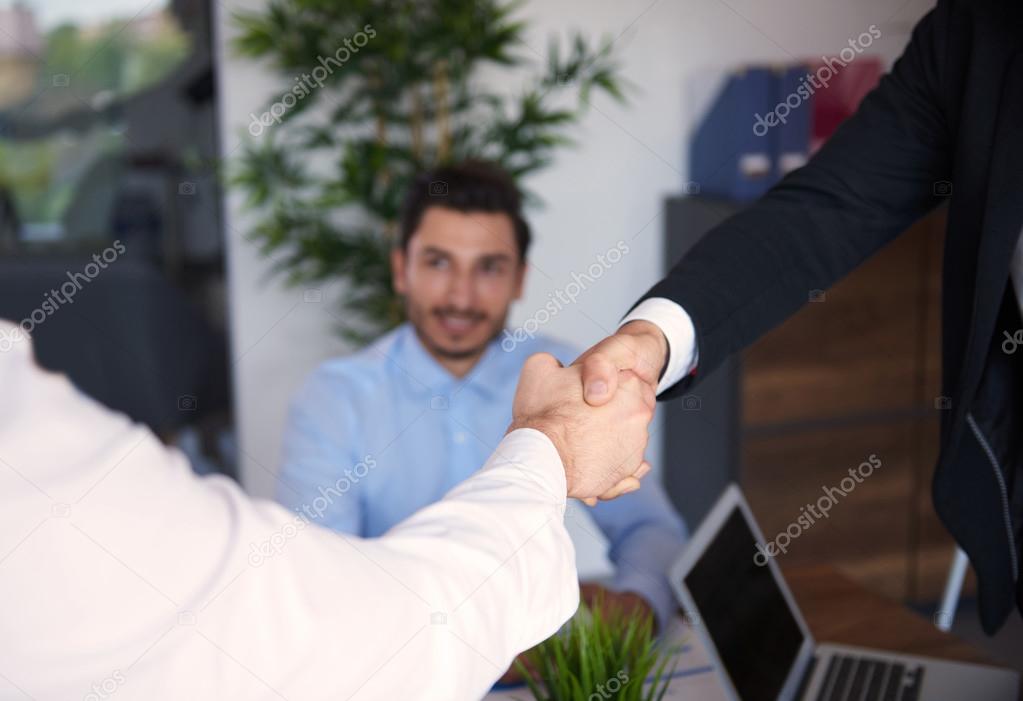 Business people shaking hands at office