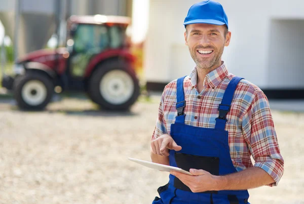 Young farmer using digital tablet — Stock Photo, Image