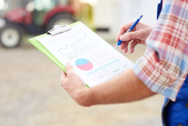 Farmer checking recent income data — Stock Photo, Image