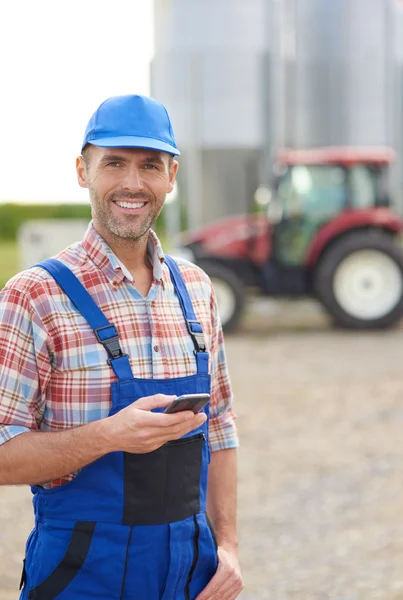 Modern farmer using mobile phone