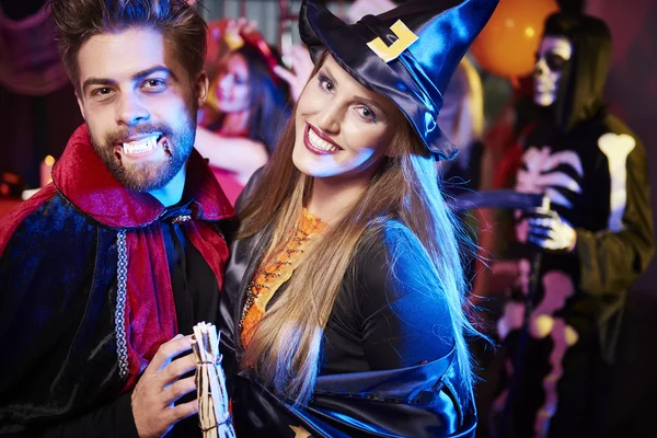 Happy witch and vampire on the party — Stock Photo, Image