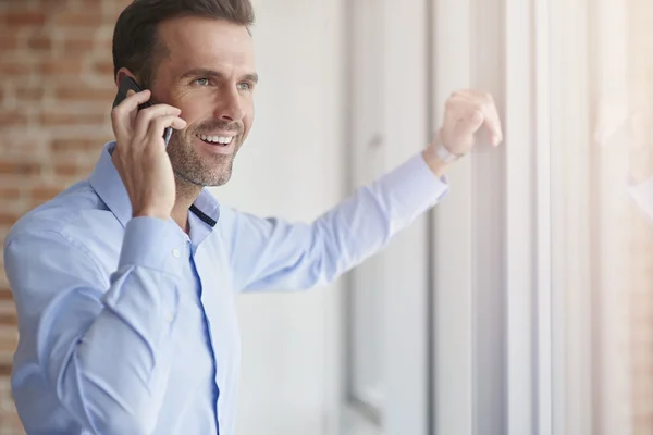 Businessman next to the window — Stock Photo, Image