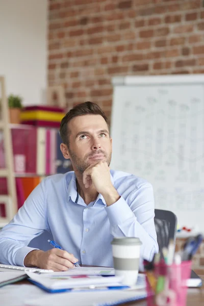 Thoughtful man sitting — Stock Photo, Image