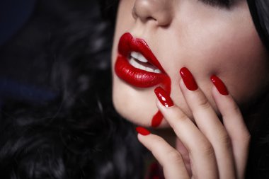 Magical woman vampire with blood on lips clipart