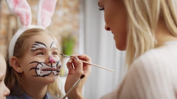 Video Mom Painting Easter Bunny Her Daughter Face Shot Red Video Clip