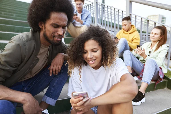 Young People Sitting Your Mobile Phones Outdoors — Stock Photo, Image