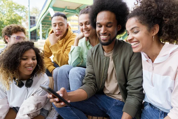 Young People Sitting Staring Cell Phone — Stock Photo, Image