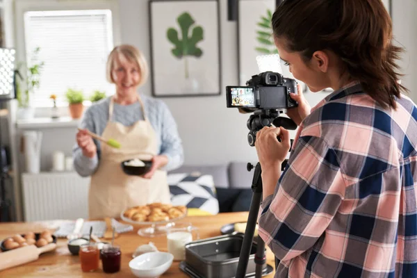Daughter Filming Mother While Cooking — Stock Photo, Image