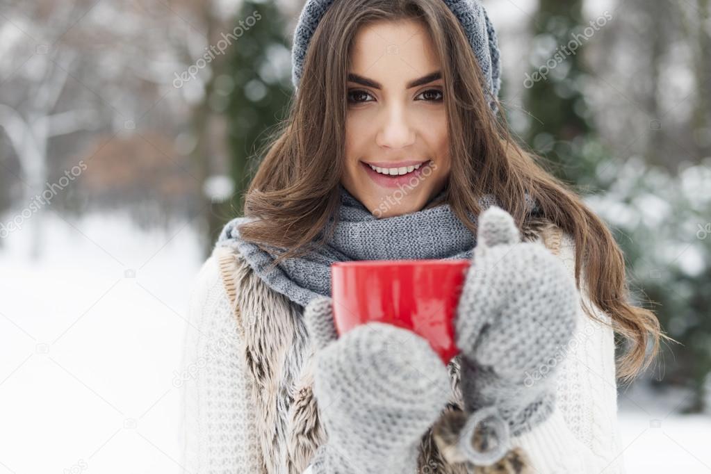 Winter woman with cup of hot tea Stock Photo by ©gpointstudio 52436417