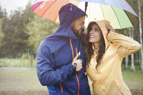 Loving couple with umbrella — Stock Photo, Image