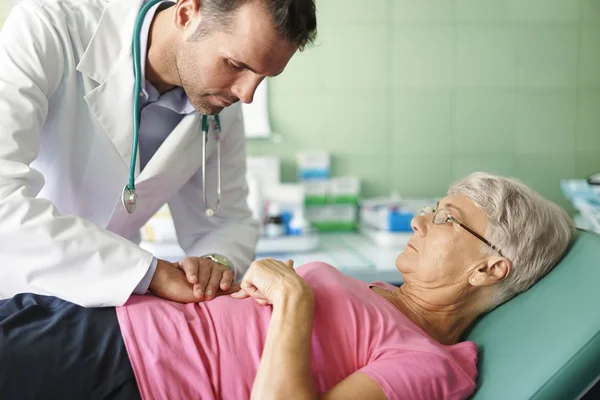 Doctor takes care about patient — Stock Photo, Image