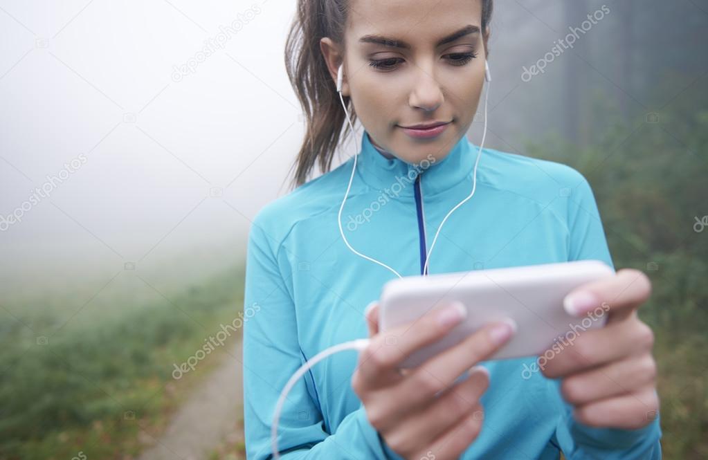 Woman listeting to music while running