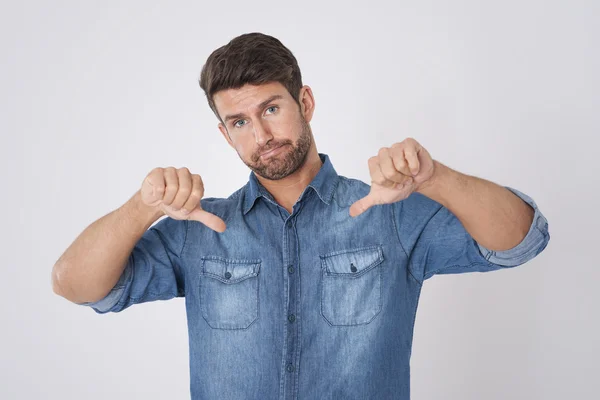 Man with thumbs down — Stock Photo, Image