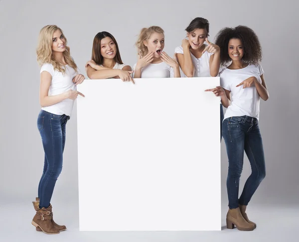 Women holding empty white board — Stock Photo, Image