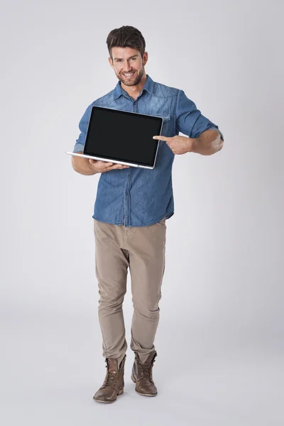 Man pointing on screen of  laptop — Stock Photo, Image