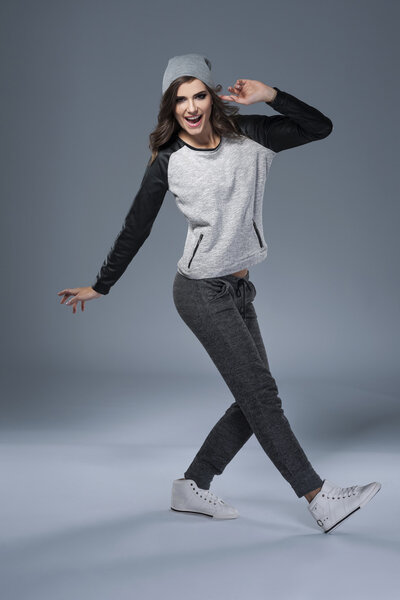 Stylish young woman dancing