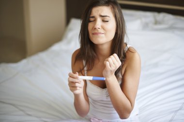 Woman with pregnancy test clipart
