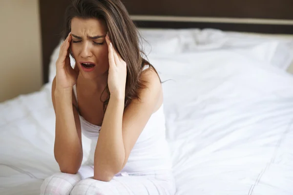 Young woman with headache — Stock Photo, Image