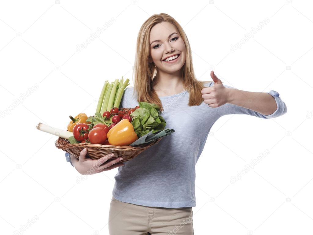 Woman with basket full of healthy food