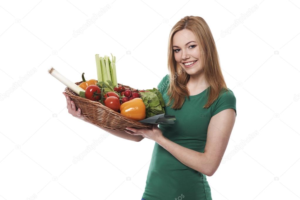 Woman with basket full of healthy food