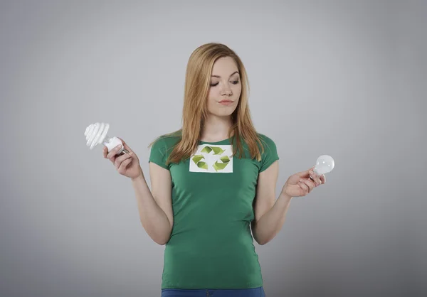 Woman with economic bulb — Stock Photo, Image