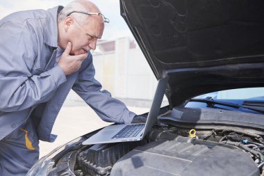 Mechanic find serious problem with electronics clipart