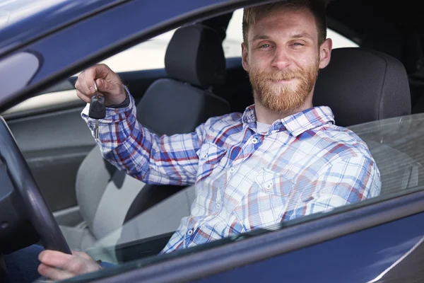 Happy man in his new car — Stock Photo, Image
